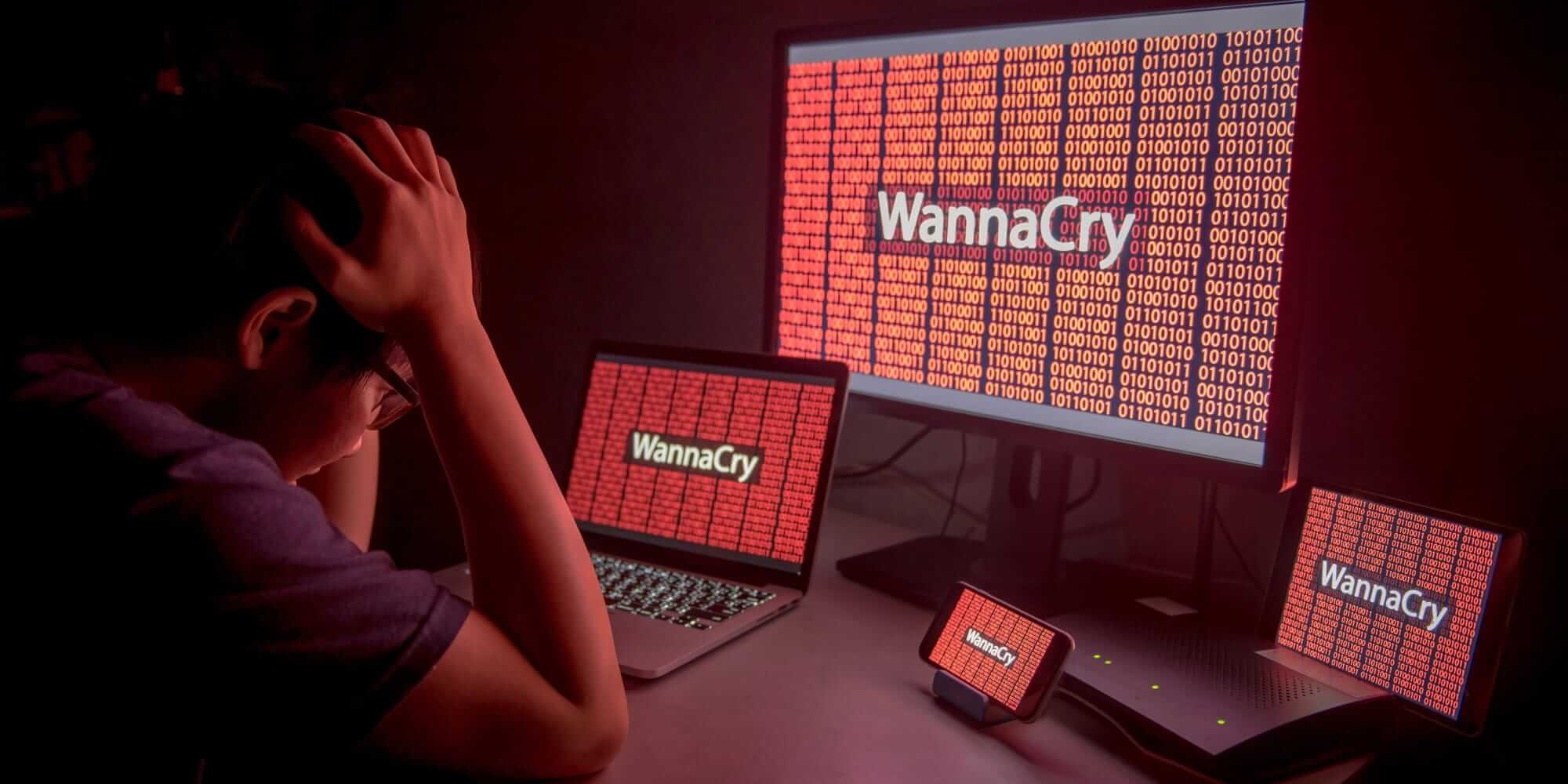 Young Asian male confused and headache by WannaCry ransomware attack